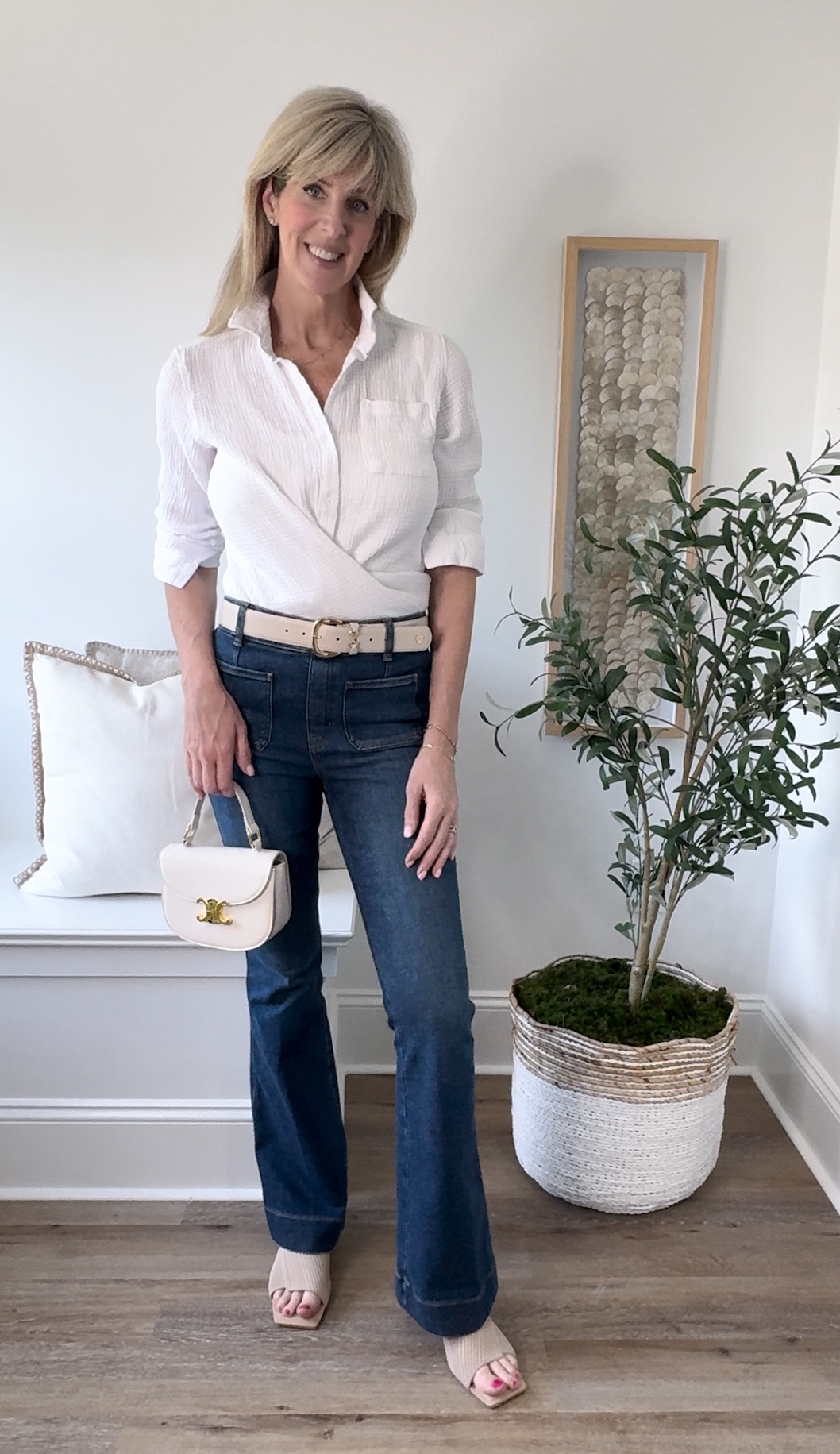 paige denim jeans paired with a white button down blouse, classic and chic outfits for owmen over 40