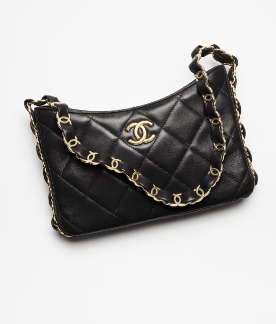 A black quilted Chanel shoulder bag with gold hardware and a gold chain strap. The chain strap features a scalloped design.